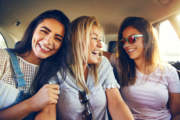 Laughing affectionate female friends - Stock Photo - Images