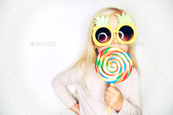 Little girl in pineapple sunglasses and - Stock Photo - Images