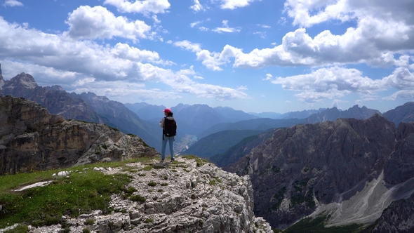 Hiker Woman Standing Up Achieving the Top Dolomites Alps alt