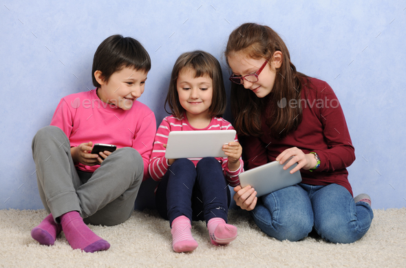 children with devices - Stock Photo - Images