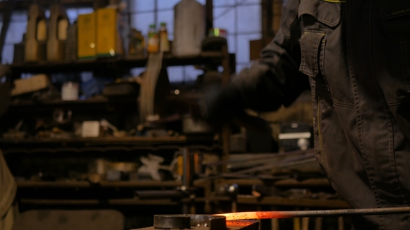 Blacksmith Forging Molten Metal