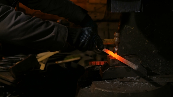 Blacksmith Forging Molten Metal