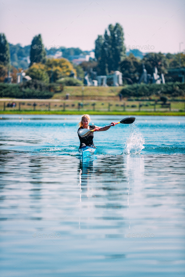 Female Athlete In Kayak Stock Photo By Microgen | PhotoDune