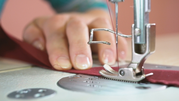 The Seamstress Sews on an Industrial Sewing Machine, Stock Footage