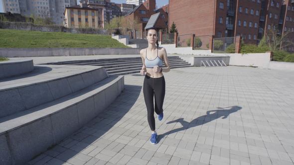 Young Woman Running in the City