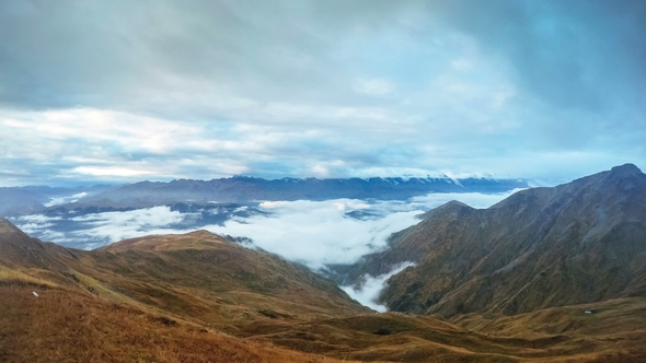Thick Clouds Floating Over Mheer Mountain Chain at Sunrise Filmed From Guli Pass