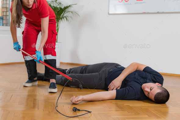 First Aid Training - Electric shock Stock Photo by microgen | PhotoDune