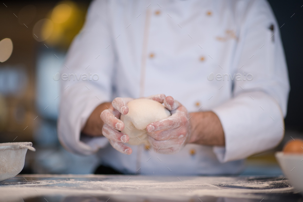 chef hands preparing dough for pizza - Stock Photo - Images