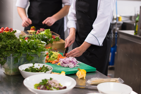 team cooks and chefs preparing meals - Stock Photo - Images