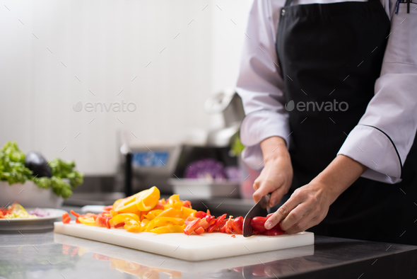 Chef cutting fresh and delicious vegetables - Stock Photo - Images
