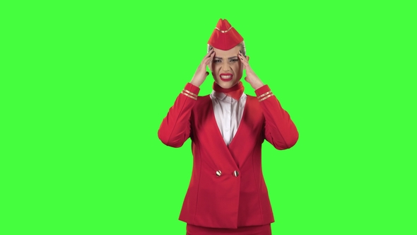 Girl Suffers From a Headache. Green Screen alt