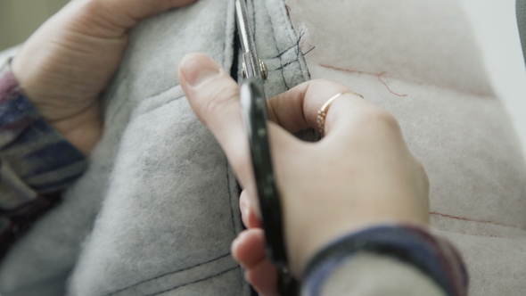 Process of Sewing Sheepskin Coat with Sewing Machine. alt