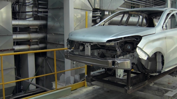 Assembly of Modern Automobiles for People, Car Body Is Moving in Workshop