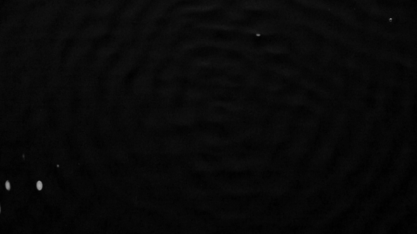 Graphic Image of Vibration of the Subwoofer on the Water Surface. Black Background. alt