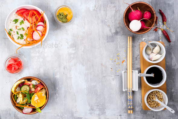 Asian spicy salad of glass noodles or funchoza with carrots and vegetables salad on stone background - Stock Photo - Images