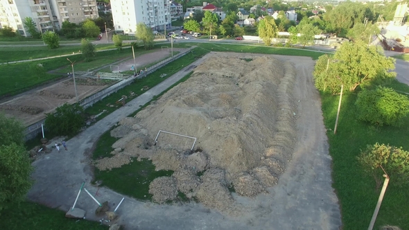 Aerial Shot of Football Field Preparing for Construction New Stadium