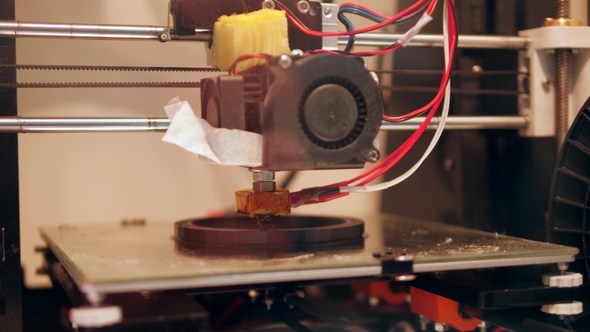 3D Printing Process with Plastic Wire Filament on Printer. .