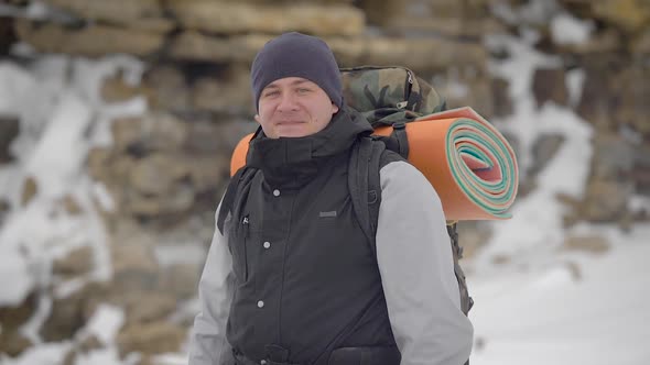 Portrait Shot of a Happy Hiker with a Bag of Equipment on His Back alt