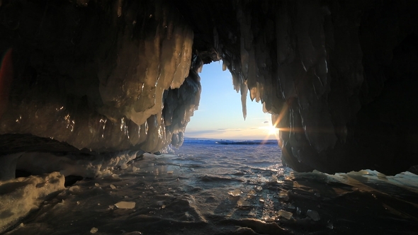 Ice Cave with Icicles at Sunset at Winter Baikal alt