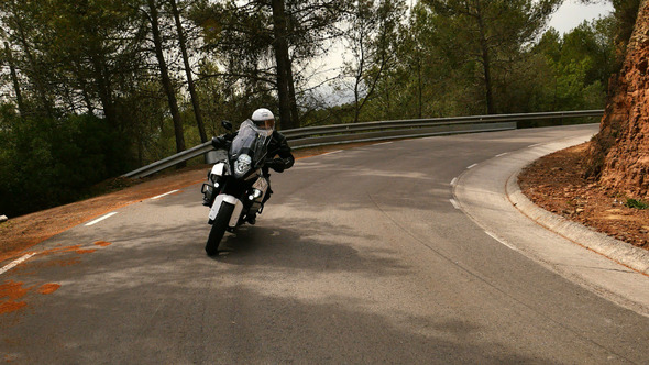 Motorcyclist Driving his Sports Motorbike on a Curvy Road