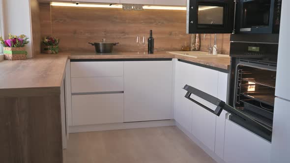 Wide Angle Tilt Shot of Modern White and Wooden Beige Kitchen Interior