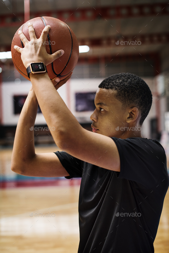 black teen playing basketball alone, digital