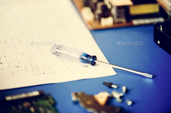 Closeup of screwdriver over circuit pattern guide line paper Stock Photo by Rawpixel