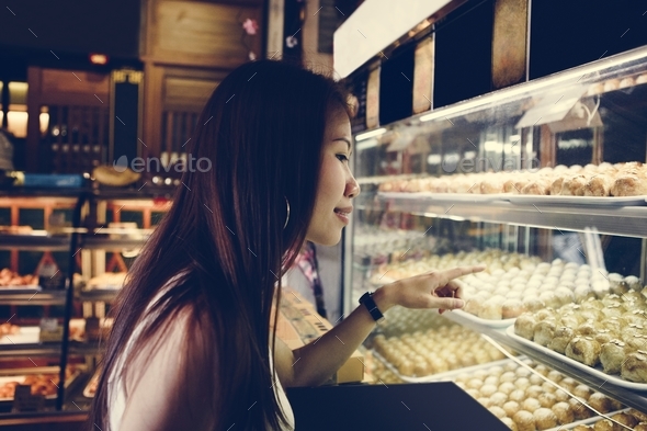 Asian girl pointing at Chinese pastries Stock Photo by Rawpixel | PhotoDune