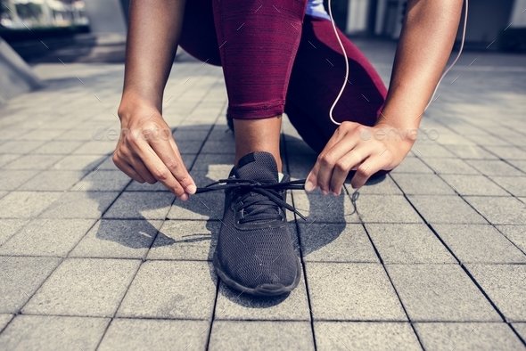 Sporty person checking shoelaces Stock Photo by Rawpixel | PhotoDune