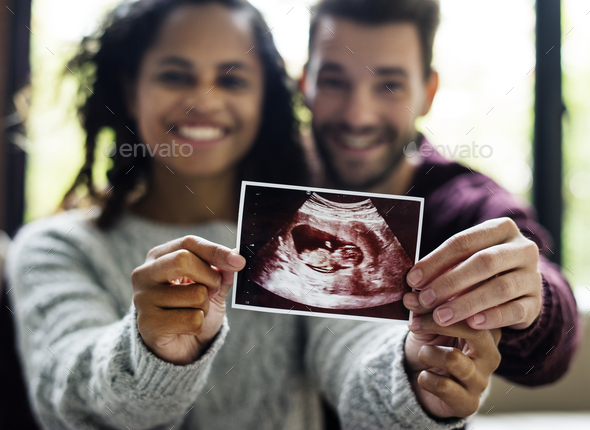 Happy couple with pregnancy news - Stock Photo - Images