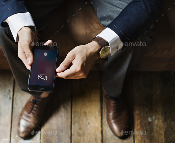 A businessman using a smartphone - Stock Photo - Images