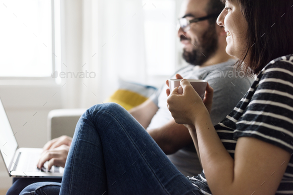 Happy couple relaxing at home - Stock Photo - Images