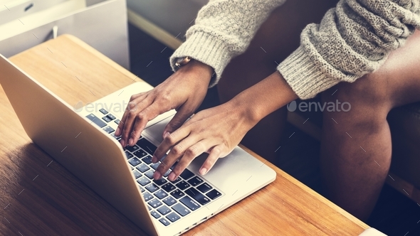 Woman working on a laptop - Stock Photo - Images