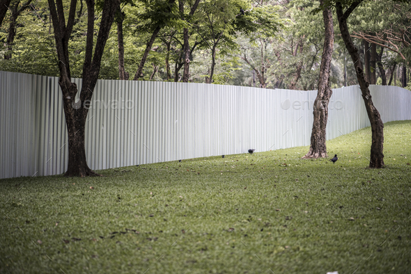 Big fence in an urban park - Stock Photo - Images