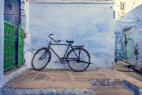 Bicycle leaning on the blue wall Stock Photo by Rawpixel | PhotoDune