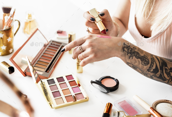 Beauty blogger producing makeup tutorial - Stock Photo - Images
