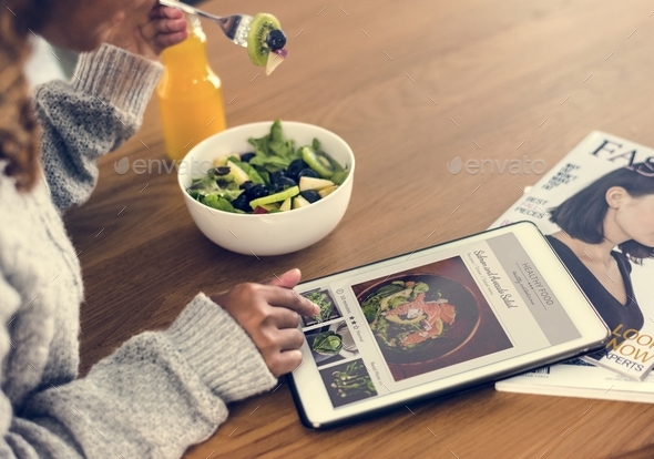 Woman looking for healthy food online - Stock Photo - Images