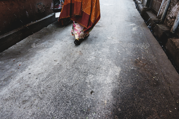 Rajasthani woman walking in the street - Stock Photo - Images