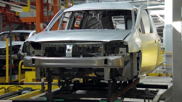 Car Body on Moving Stand on Conveyor During Assembly of Automobiles
