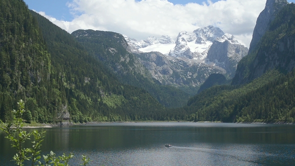 Beautiful Mountain Lake in the Morning. Snow-capped Alps in the Background alt