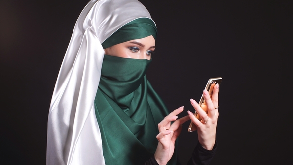 Portrait of Beautiful Arabic Muslim Girl Using Mobile Phone, Stock Footage