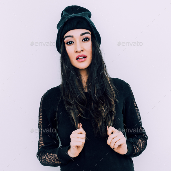 Stylish brunette in black beanie cap. Swag urban style - Stock Photo - Images