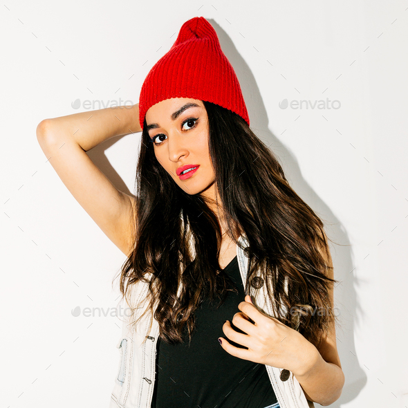 Brunette Pretty girl in fashion beanie cap. Urban style - Stock Photo - Images
