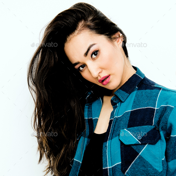 Beautiful brunette Girl with long hair in checkered shirt. Casua - Stock Photo - Images