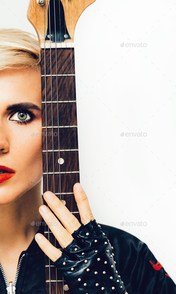 Sensual Model with electro guitar. Rock style Stock Photo by EvgeniyaPorechenskaya