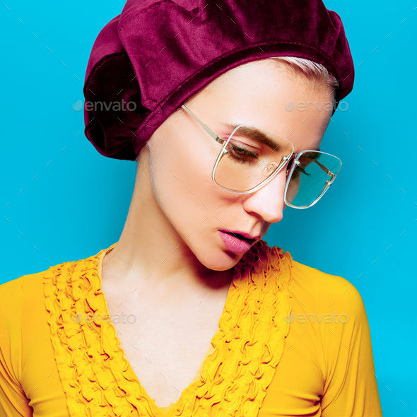 Model in fashion accessory beret and glasses. Retro style - Stock Photo - Images