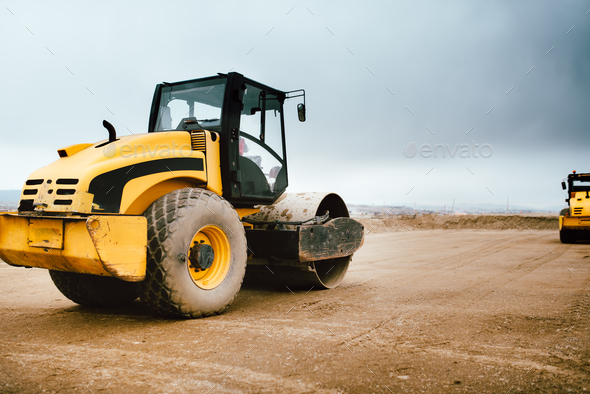 Tandem Road Roller vibroroller finishing the earth layer at road construction Stock Photo by stockcentral