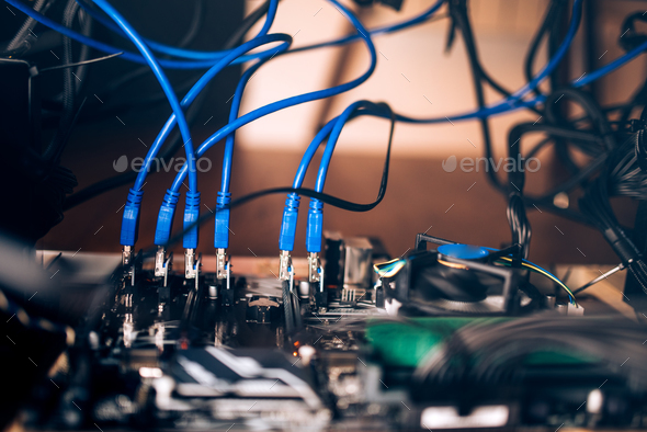 Details of modern mining rig. Graphics cards with power supply mining cryptocurrency Stock Photo by stockcentral