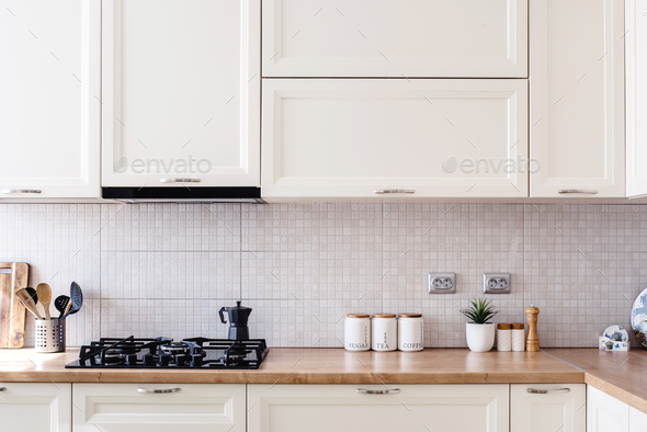Interior kitchen design details - modern cabinets and wooden furniture Stock Photo by stockcentral