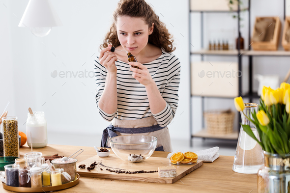 Woman smelling essential oil